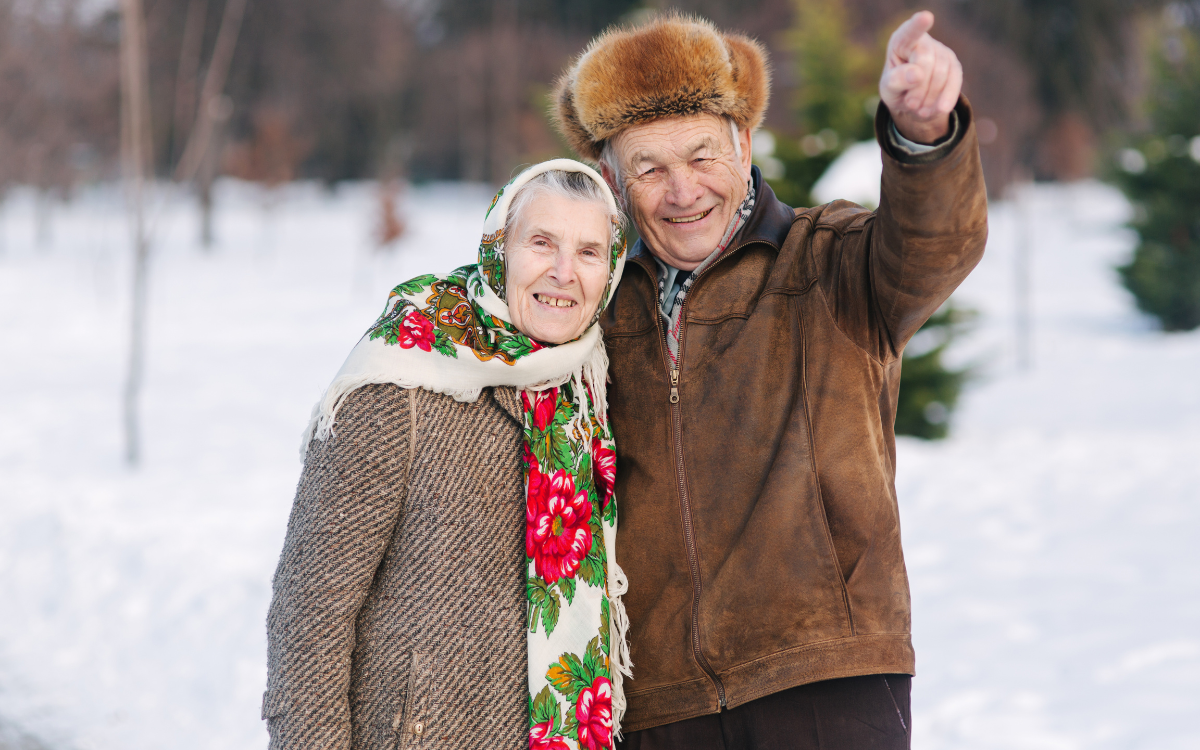 Senior couple smiling in the winter weather